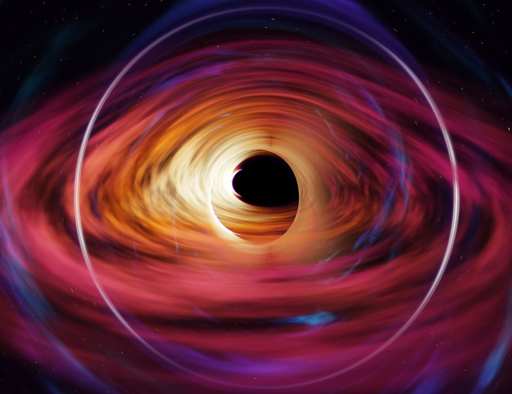 A thin white ring around the black hole and its magenta disk: the image of a galaxy behind it.